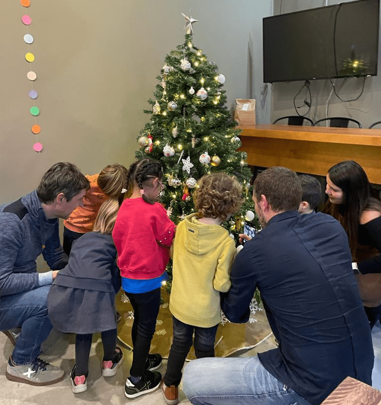 The kids of NPAW team members decorate our office Christmas tree